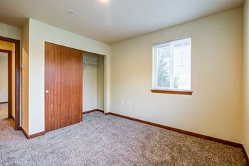 Bedroom with closet and window